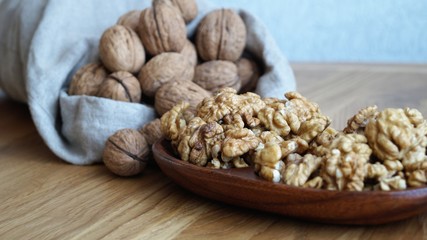 walnut kernels in a wooden dish
