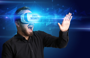 Businessman looking through Virtual Reality glasses with EMAIL SECURITY inscription, cyber security concept