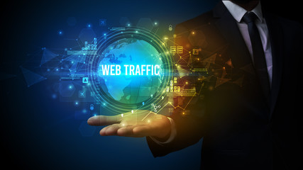 Elegant hand holding WEB TRAFFIC inscription, digital technology concept