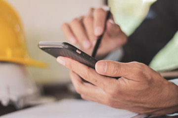 Businessman use smart phone working in office