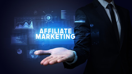 Hand of Businessman holding AFFILIATE MARKETING inscription, business success concept