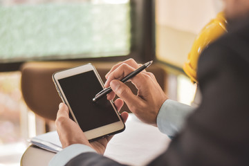 Businessman use smart phone working in office