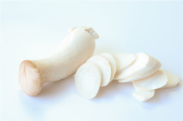 Fresh King Oyster Mushroom or origin with cut slice isolated on white background.