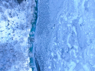 downward drone shot of norwegian snow landscape