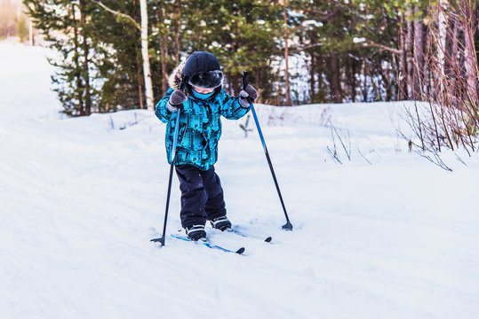 boy skiing in the woods