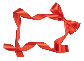 Red satin ribbon and bow in frame shape isolated on white background.