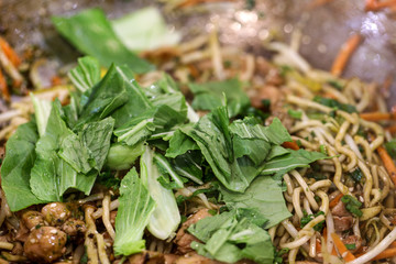 Fototapeta premium Chicken chow mein a popular oriental dish available at chinese restaurants