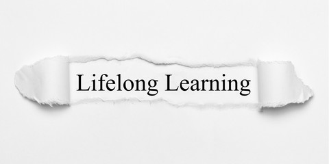 Lifelong Learning on white torn paper