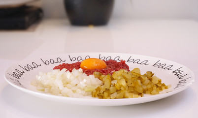 steak tartare - raw, chopped meat and yolk