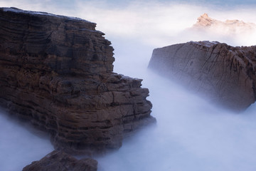 rocks crashed by sea waves