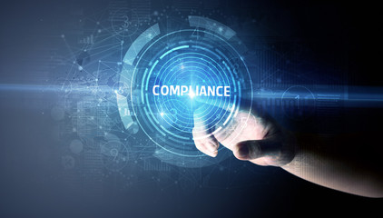 Hand touching COMPLIANCE button, modern business technology concept