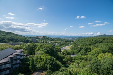 Fototapeta na wymiar Aerial view of Arima Onsen city with mountains and traditional Japanese buildings