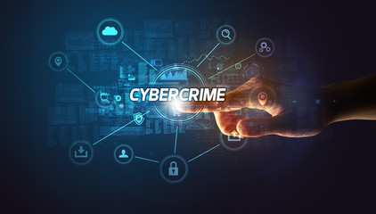 Hand touching CYBERCRIME inscription, Cybersecurity concept