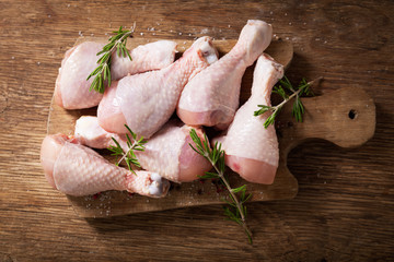 fresh chicken meat with rosemary and spices, top view