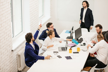 successful creative business team in modern office, young caucasian people business partners conducted meeting for better joint work