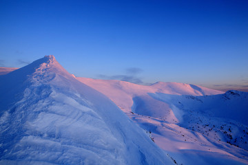 Sunset in winter mountains. Eastern Europe.