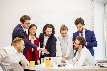 best workers of successful busness team gathered in office to discuss new business project, to plan...