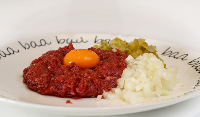 steak tartare - raw, chopped meat and yolk