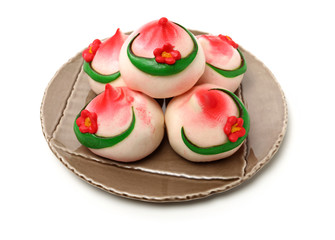 Traditional Chinese birthday bun named Shou Bao served on birthdays on white background