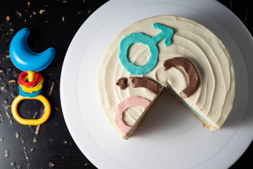 Cake with vanilla biscuit. Mars and Venus? View from above. Classic cheesecake. Cheese cream. With a baby rattle.