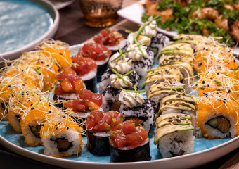 Fresh and delicious sushi on a wooden table Japanese food self made sushi set at home or restaurant.