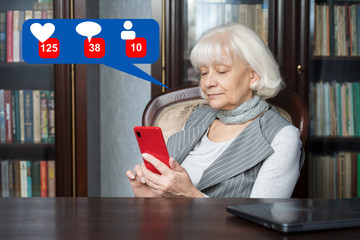 Beautiful old woman reads social networks on his smartphone. She is thinking of gaining more likes and followers. Modern and fashionable woman.
