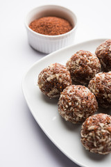 Aliv Laddu, Halim Ladoo or Garden cress Seed sweet Balls a very nutritious food in winters or for New Moms. popular food from India. served in a bowl or plate