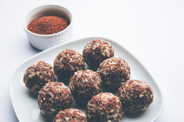 Aliv Laddu, Halim Ladoo or Garden cress Seed sweet Balls a very nutritious food in winters or for New Moms. popular food from India. served in a bowl or plate