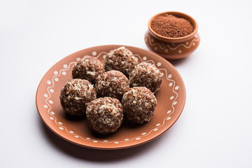 Aliv Laddu, Halim Ladoo or Garden cress Seed sweet Balls a very nutritious food in winters or for New Moms. popular food from India. served in a bowl or plate