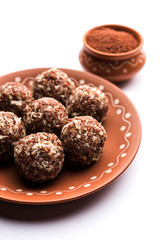 Aliv Laddu, Halim Ladoo or Garden cress Seed sweet Balls a very nutritious food in winters or for New Moms. popular food from India. served in a bowl or plate