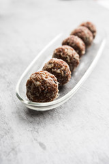 Aliv Laddu, Halim Ladoo or Garden cress Seed sweet Balls a very nutritious food in winters or for New Moms. popular food from India. served in a bowl or plate