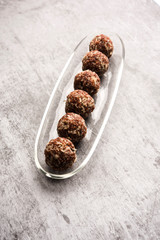 Aliv Laddu, Halim Ladoo or Garden cress Seed sweet Balls a very nutritious food in winters or for New Moms. popular food from India. served in a bowl or plate