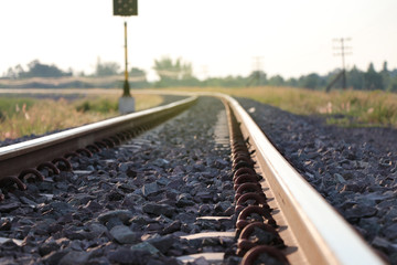 Curved railway track with sunset, concept  to work meet target for business and work life 