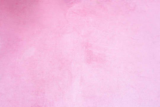 Close up of pink velvet fabric background texture, soft pastel pink textile
