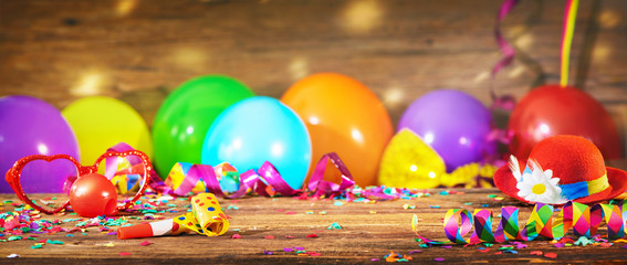 Colorful carnival or birthday background with party hat and balloons