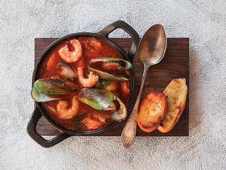 Bouillabaisse French fish soup with seafood, salmon fillet, shrimp, rich taste. traditional French...