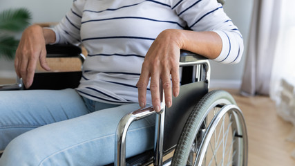 Obraz premium Close up disabled older woman sitting in wheelchair
