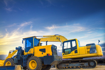 yellow dump truck on the road
