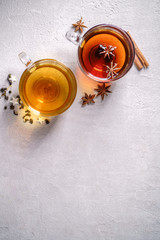 Various kinds of tea, collection of cinnamon anise spiced black and lemon flavored green tea in glass mugs