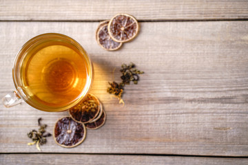 Green tea in glass cup, tonic and antioxidant drink, healthy lifestyle. Lemon flavored beverage
