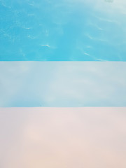 Clear water in the pool with reflection, place for text, wallpaper