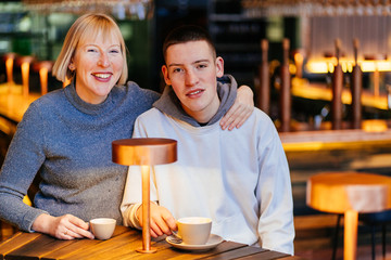 Portrait of grandson and his mother relaxing in cafe,Family Concept.