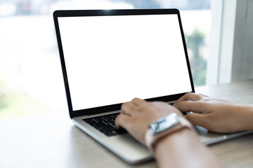 Mockup of a businessman using laptop computer white screen mockup template with clipping path.