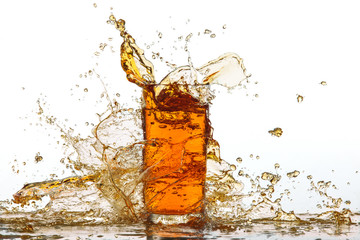 Glass of splashing drink.