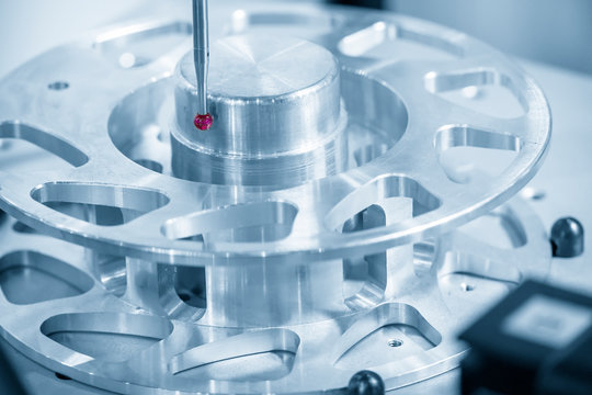 The Coordinate Measuring machine ,CMM probe  measure dimension of the aluminium  parts .The quality control in automotive  parts manufacturing process by multi-axis CMM machine.