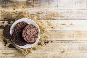 Double chocolate chip cookies on wooden table