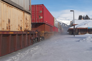 Passing freight train at the Banff Train Station in Alberta, Canada