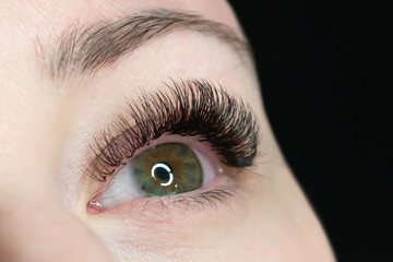 Woman with a beautiful eyelashes extension.