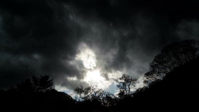Dark clouds flow over the mountain