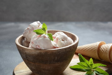 Traditional Spanish andalusian tomato cream soup Salmorejo served with egg, ham jamon, bread in woooden bowl. Summer cold soup concept